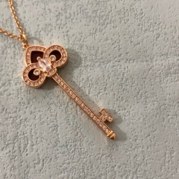 Symbolic Gold Key Necklace with Gemstone Detailing - Picture 3 of 6